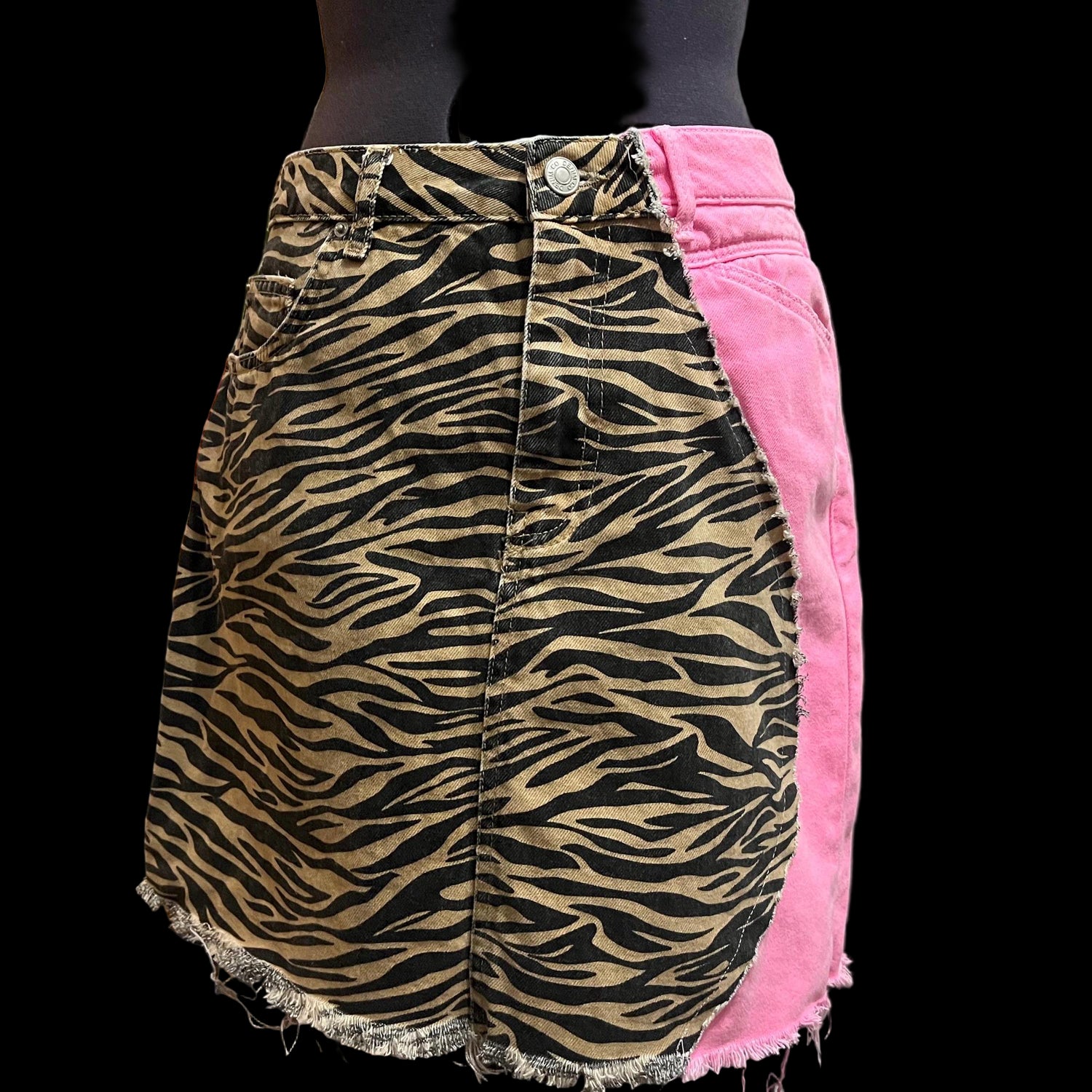 Skirt with zebra pattern and pink on a mannequin against a neutral background