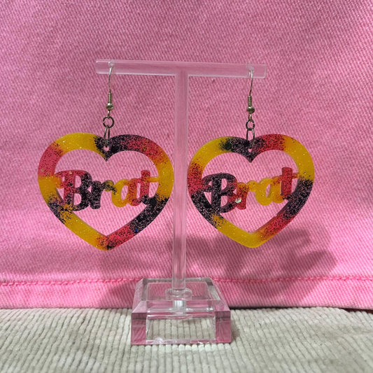 Yellow, black and Red glitter dangle drop clip on brat earrings