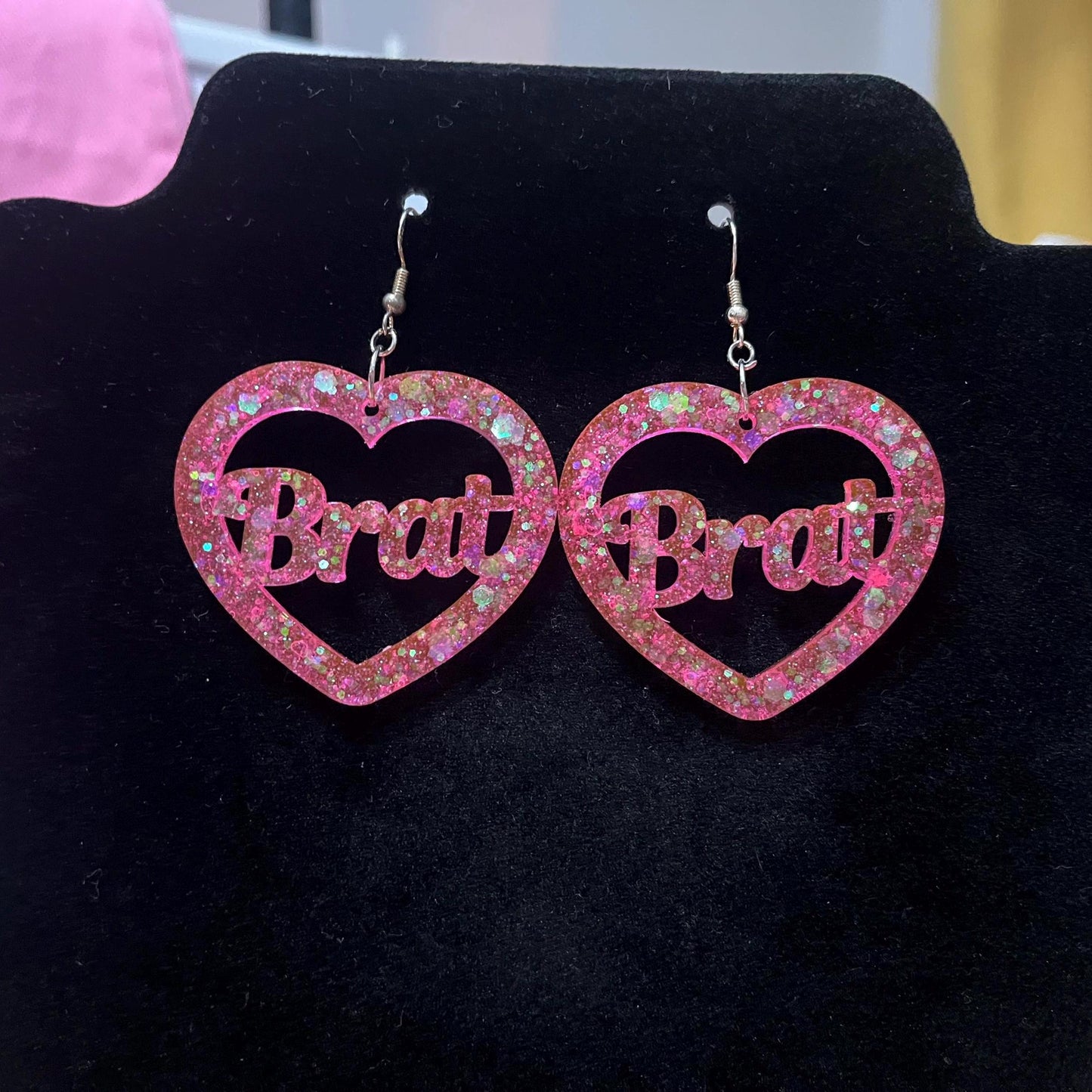 Pink glitter bitch or brat dangle drop earrings or clip ons