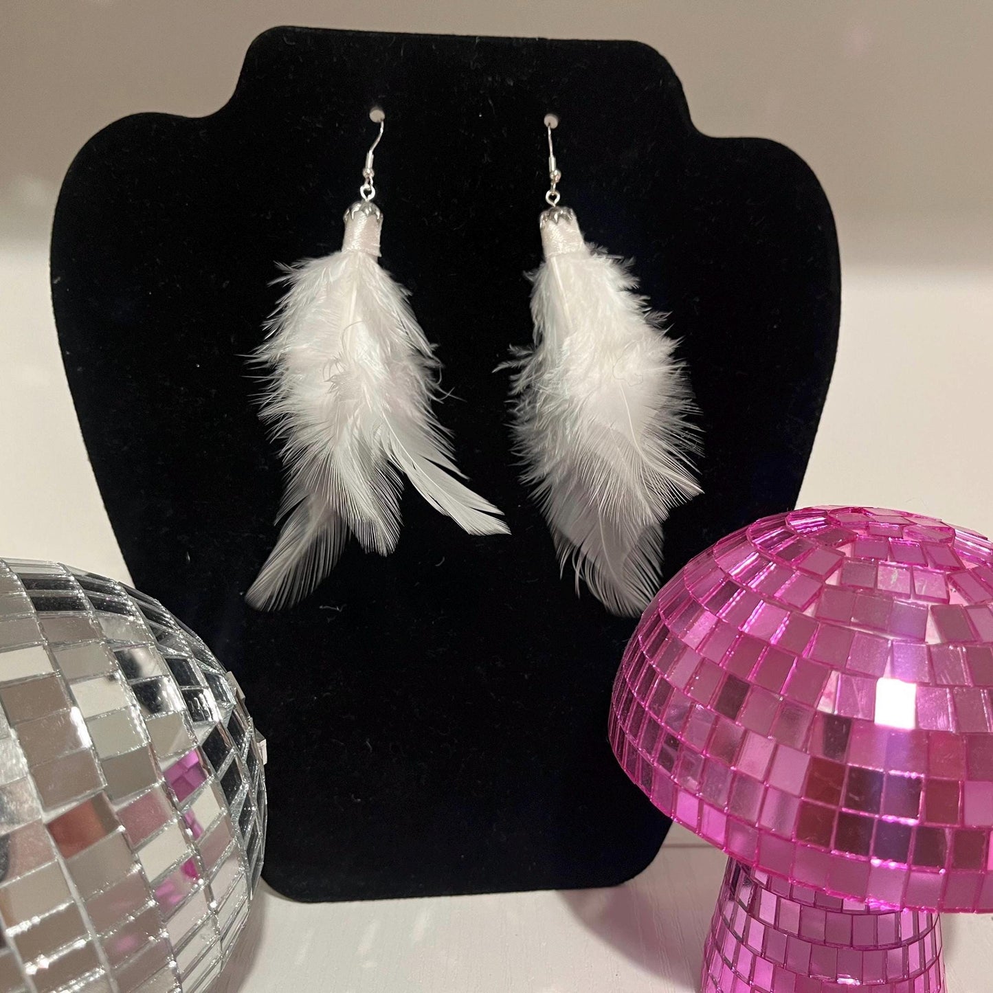 Handmade feather dangle drop earrings available in pink, white or black, sterling silver plated hardware