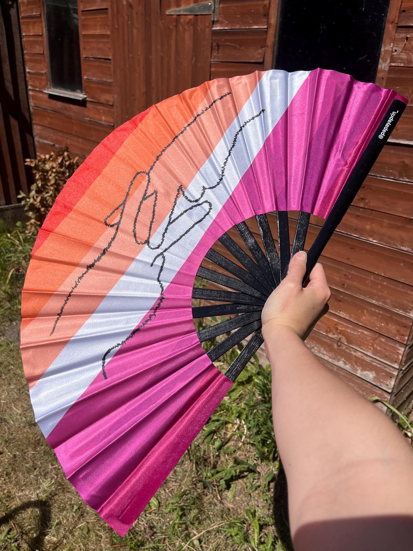 Huge colourful clacker fan for raving, pride, or fanning yourself whilst you have a panic attack
