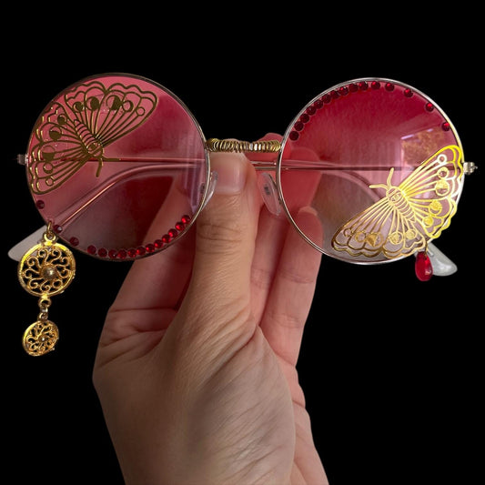 Round moth gold and red glasses