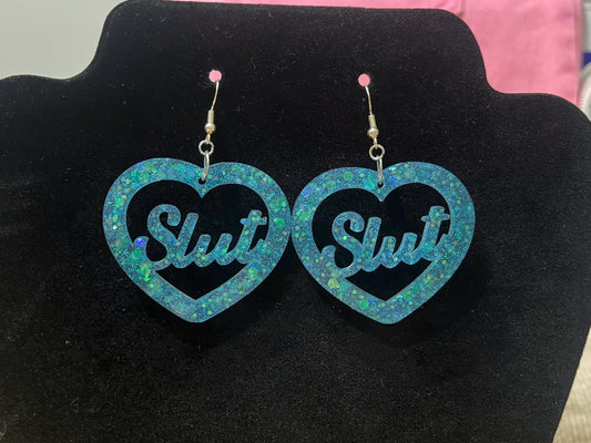 Aqua blue glitter dangle drop clip on bitch or slut earrings