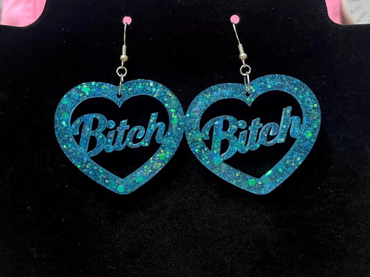 Aqua blue glitter dangle drop clip on bitch or slut earrings