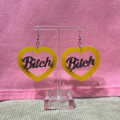 Black and Yellow glitter dangle drop clip on bitch or slut earrings
