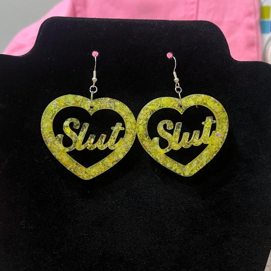UV yellow glow glitter dangle drop clip on bitch or slut earrings