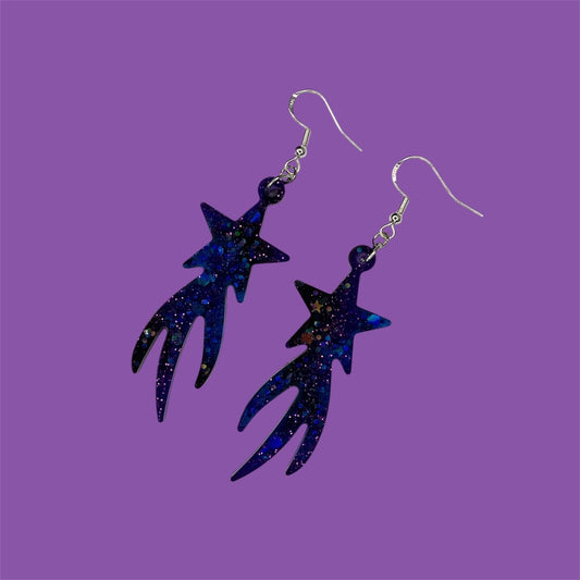 Cosmic vibes dangle drop glittery earrings in black, purple and blue. Silver plated hardware