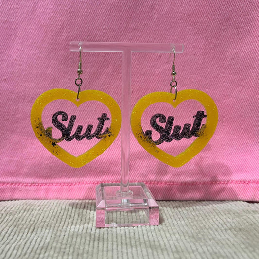 Black and Yellow glitter dangle drop clip on bitch or slut earrings