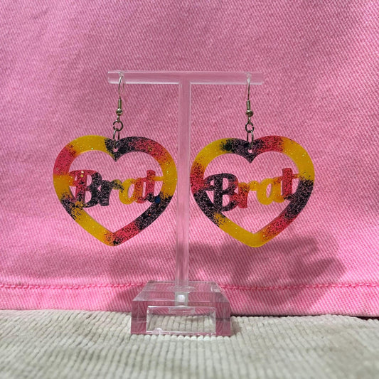 Yellow, black and Red glitter dangle drop clip on brat earrings