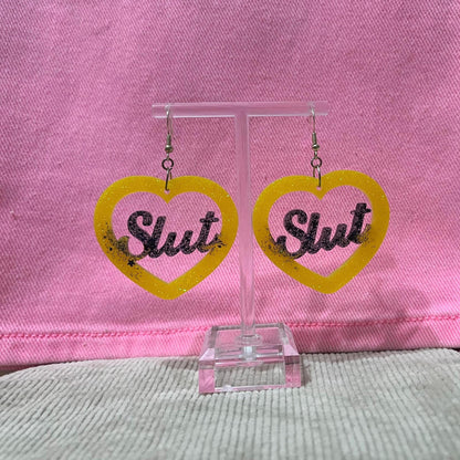 Black and Yellow glitter dangle drop clip on bitch or slut earrings